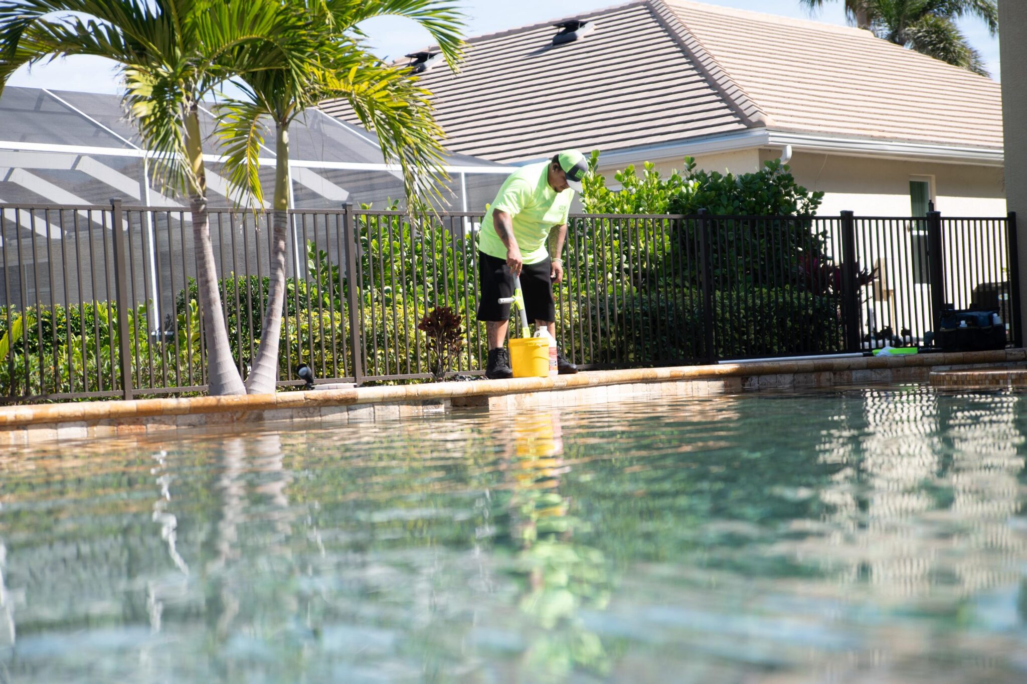 Pool doctor pool tech cleaning a pool
