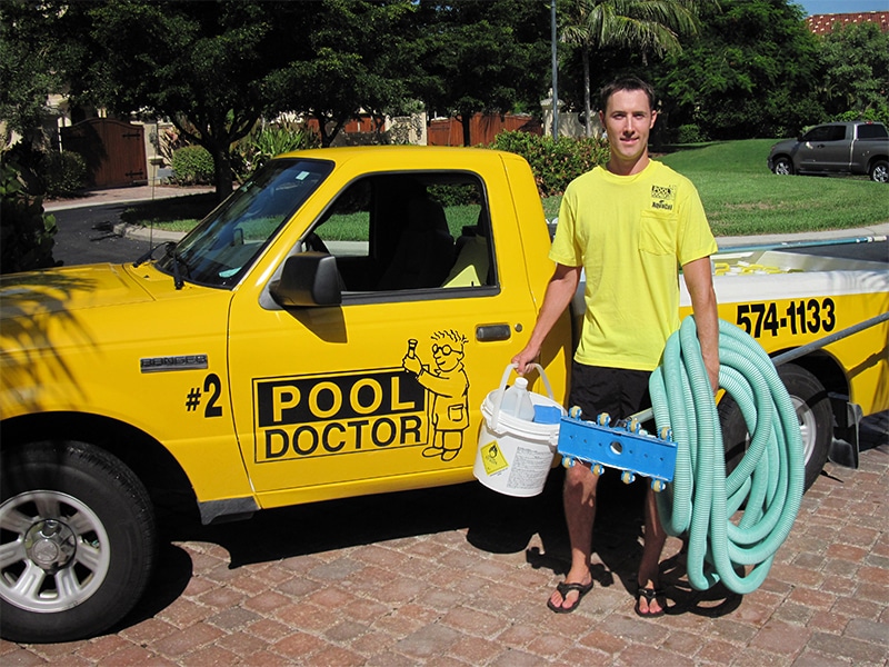 Pool Doctor technician stands in front of truck in Fort Myers